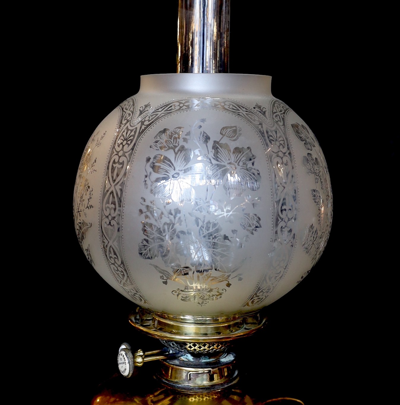 A Victorian brass Regency style print Corinthian telescopic oil lamp standard, with later etched glass globe and Williams & Bach of 92 New Bond Street London mechanism, height 170cm. width of base 34cm.